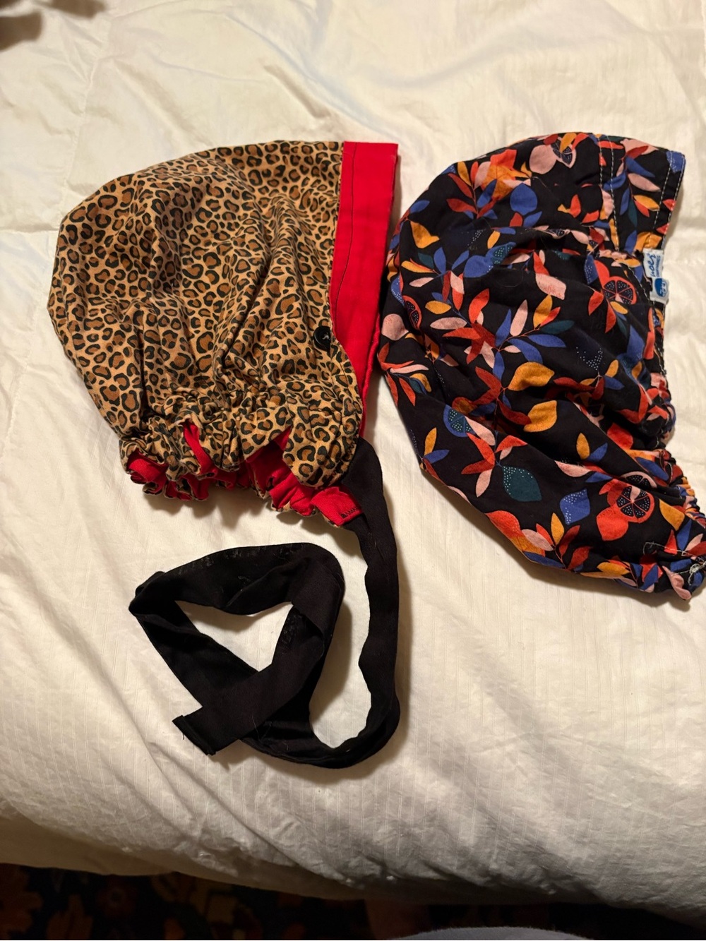 Reversible Leopard print and Floral print scrub caps.